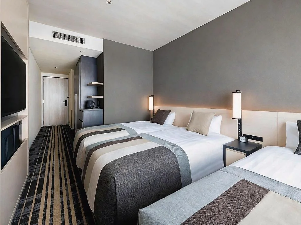 เตียงสามเตียงในห้อง Standard Triple ของ Hotel Hankyu RESPIRE OSAKA